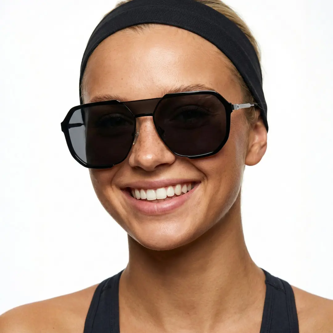 Front view of female wearing black aviator sunglasses, smiling, AR0042410