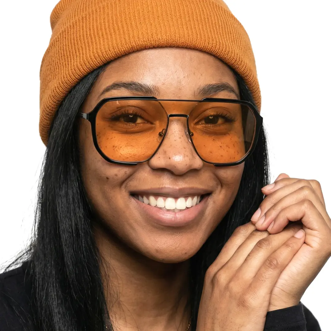 Front view of female wearing orange aviator sunglasses, friendly smile, AR0042410