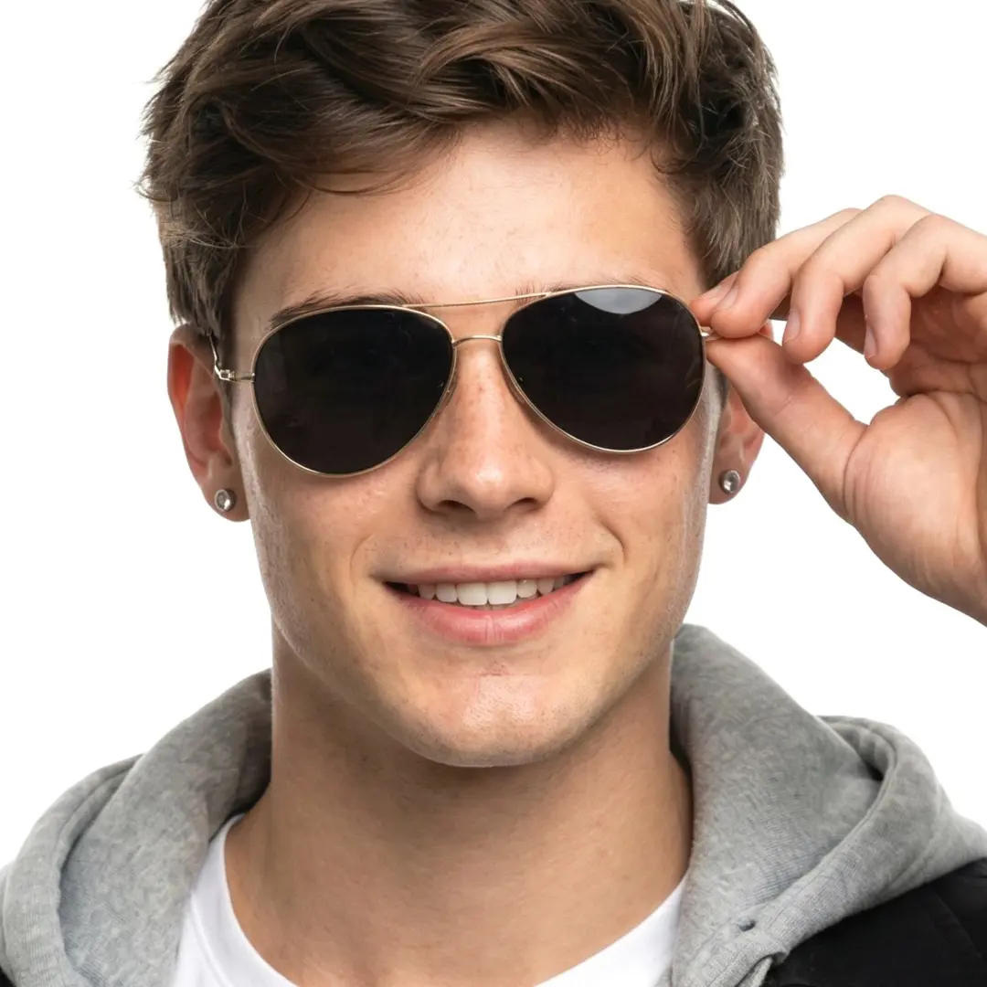 Front view of male wearing gray aviator sunglasses, holding glasses, natural smile, AT0262601S