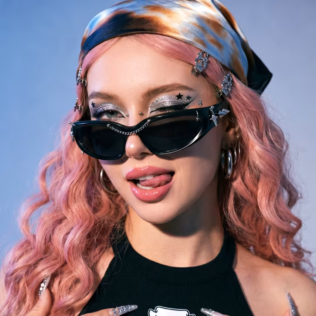 Female wearing black cat eye pc sunglasses, winking while looking at camera. SPU: CP0032511