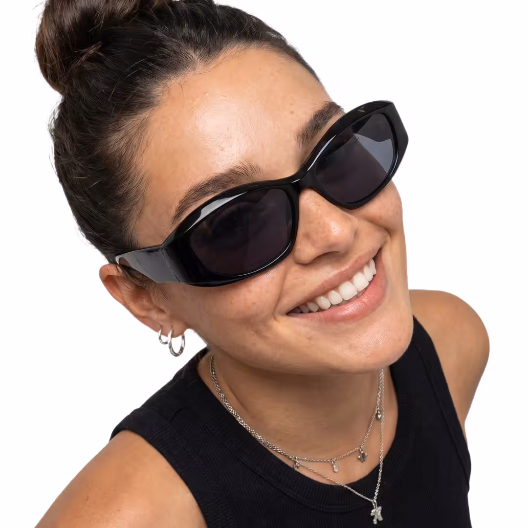 Close-up view of female wearing y2k black cat eye sunglasses, smiling, CP0172603