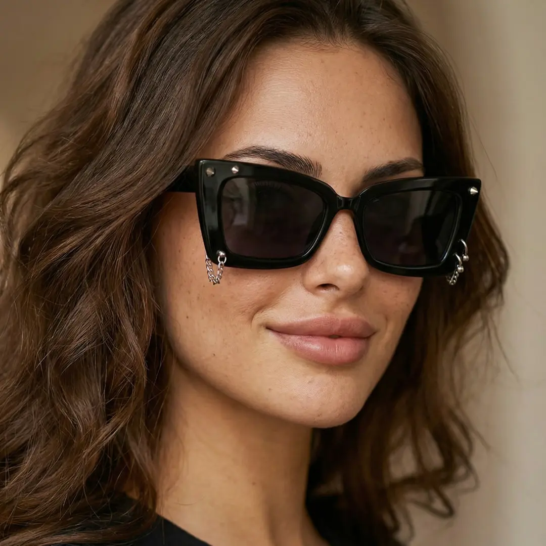 Three-quarter view of female wearing black cat eye handcrafted polarized sunglasses, natural expression, CR0032509