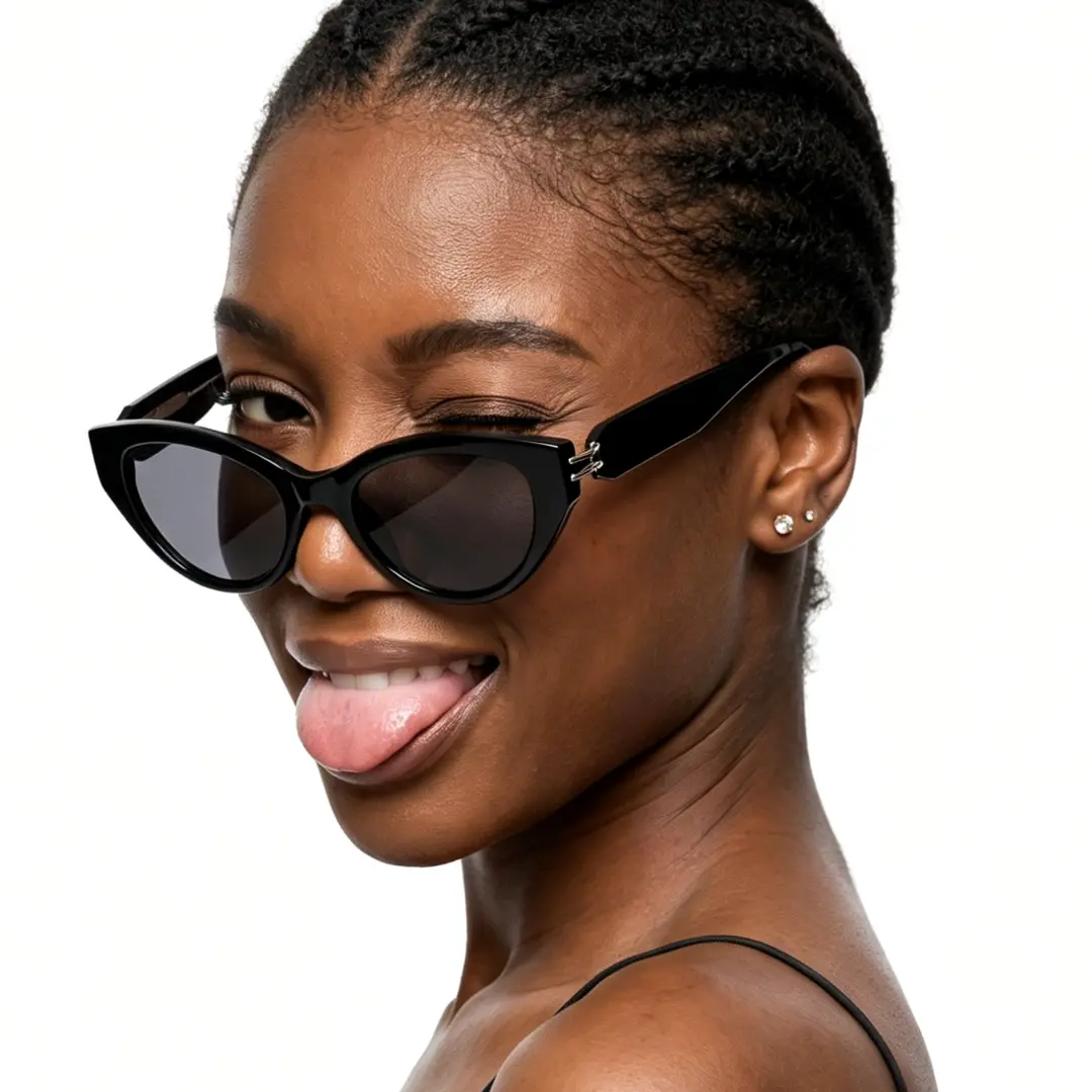 Over-the-shoulder view of female wearing fashion black cat eye sunglasses, sticking out tongue, confident expression, CR0042604