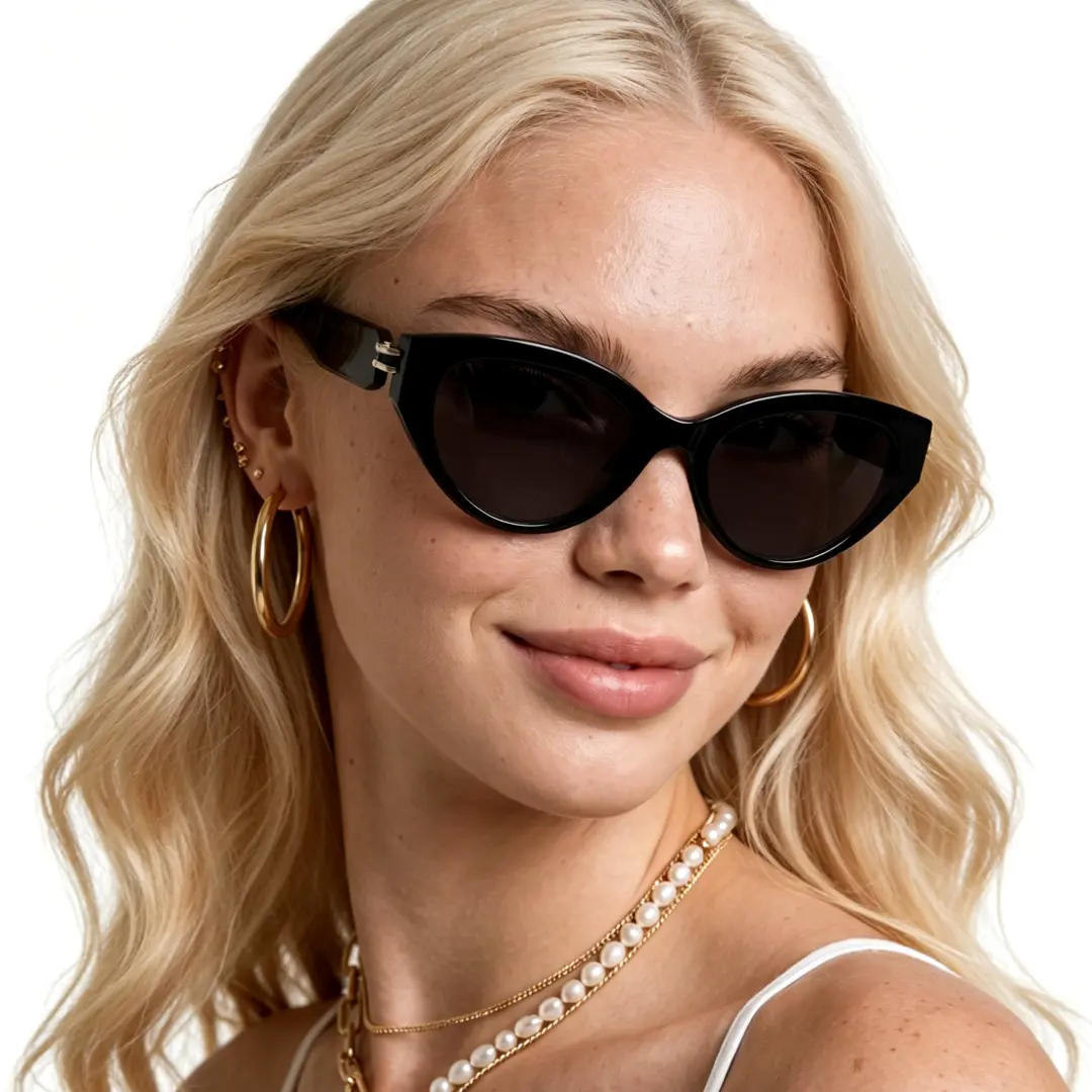 Front view of female wearing fashion black cat eye sunglasses, tilting head, natural smile, CR0042604