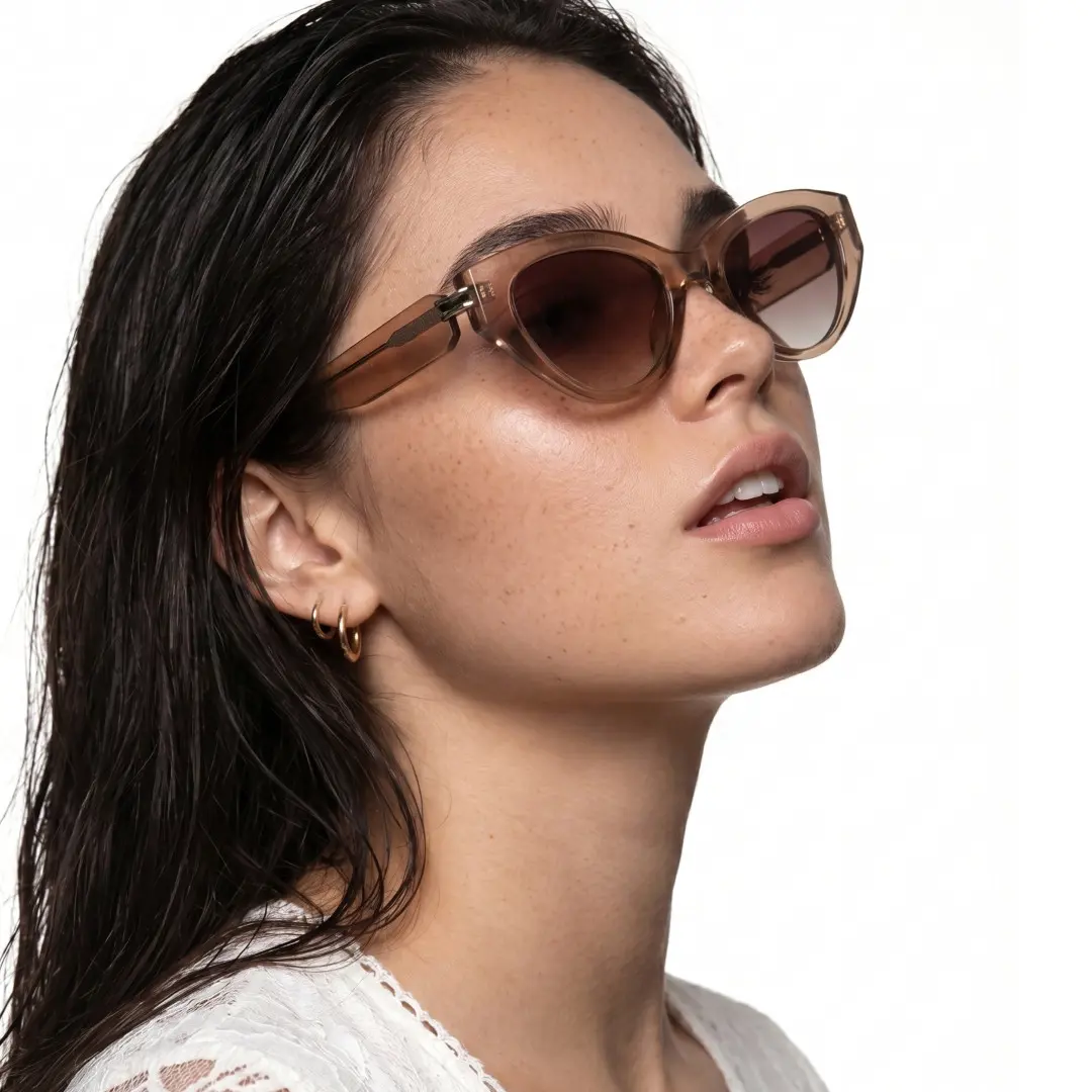 Profile view of female wearing fashion brown cat eye sunglasses, relaxed expression, CR0042604