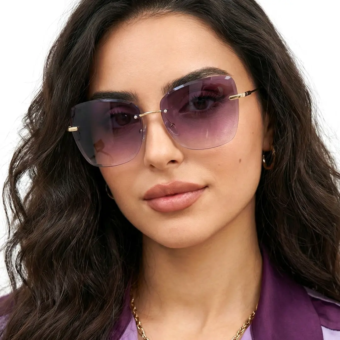 Front view of female wearing gray cat eye sunglasses, smiling, CX0102505