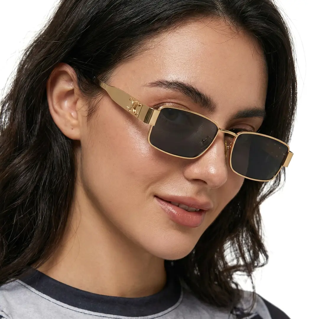 Three-quarter view of female wearing fashion gold rectangle sunglasses, natural smile, EM0092410