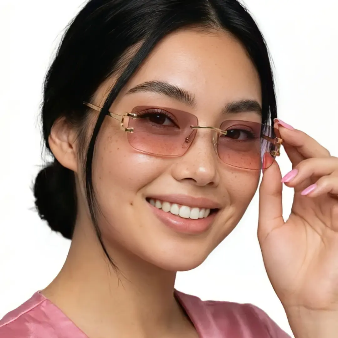 Front view of female wearing pink rectangle sunglasses, touching frame, natural smile, EM0122410