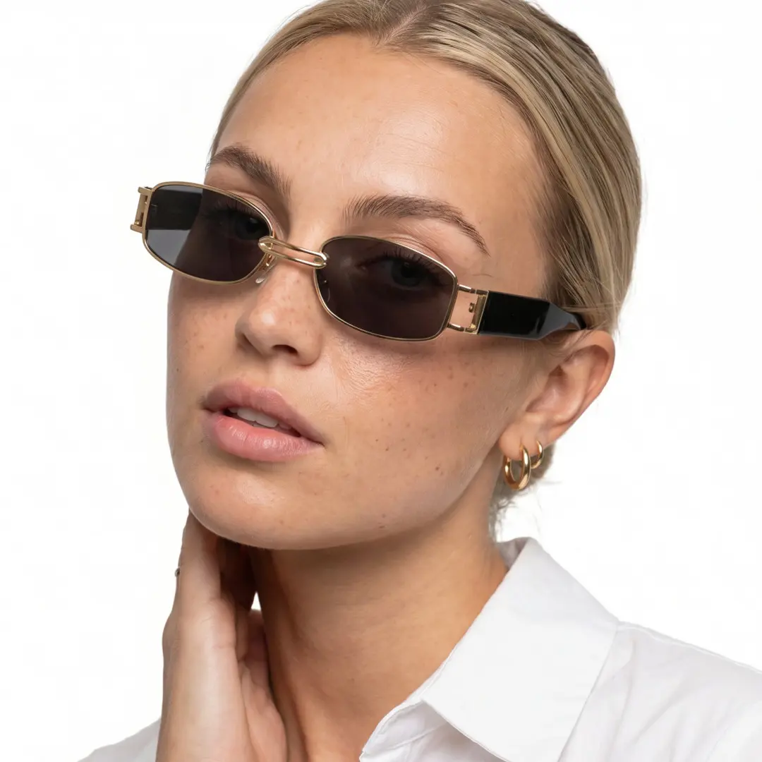 Female wearing fashion gold rectangle metal sunglasses, relaxed expression while hand near face. SPU: EM0192303