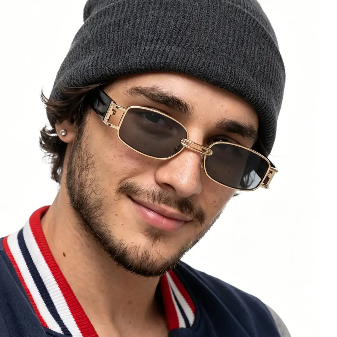 Front view of male wearing gold rectangle sunglasses, tilting head, natural smile, EM0192303