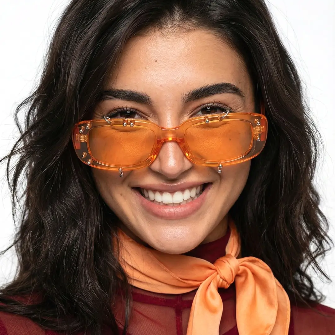 Close-up view of female wearing orange rectangle sunglasses, natural smile, EP0022511