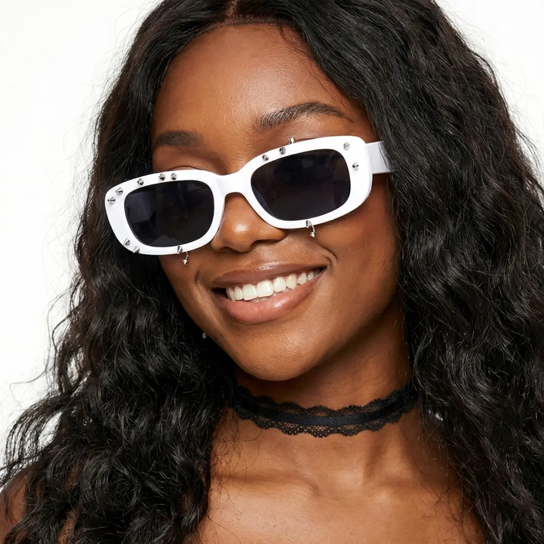 Front view of female wearing white rectangle sunglasses, smiling, EP0022511