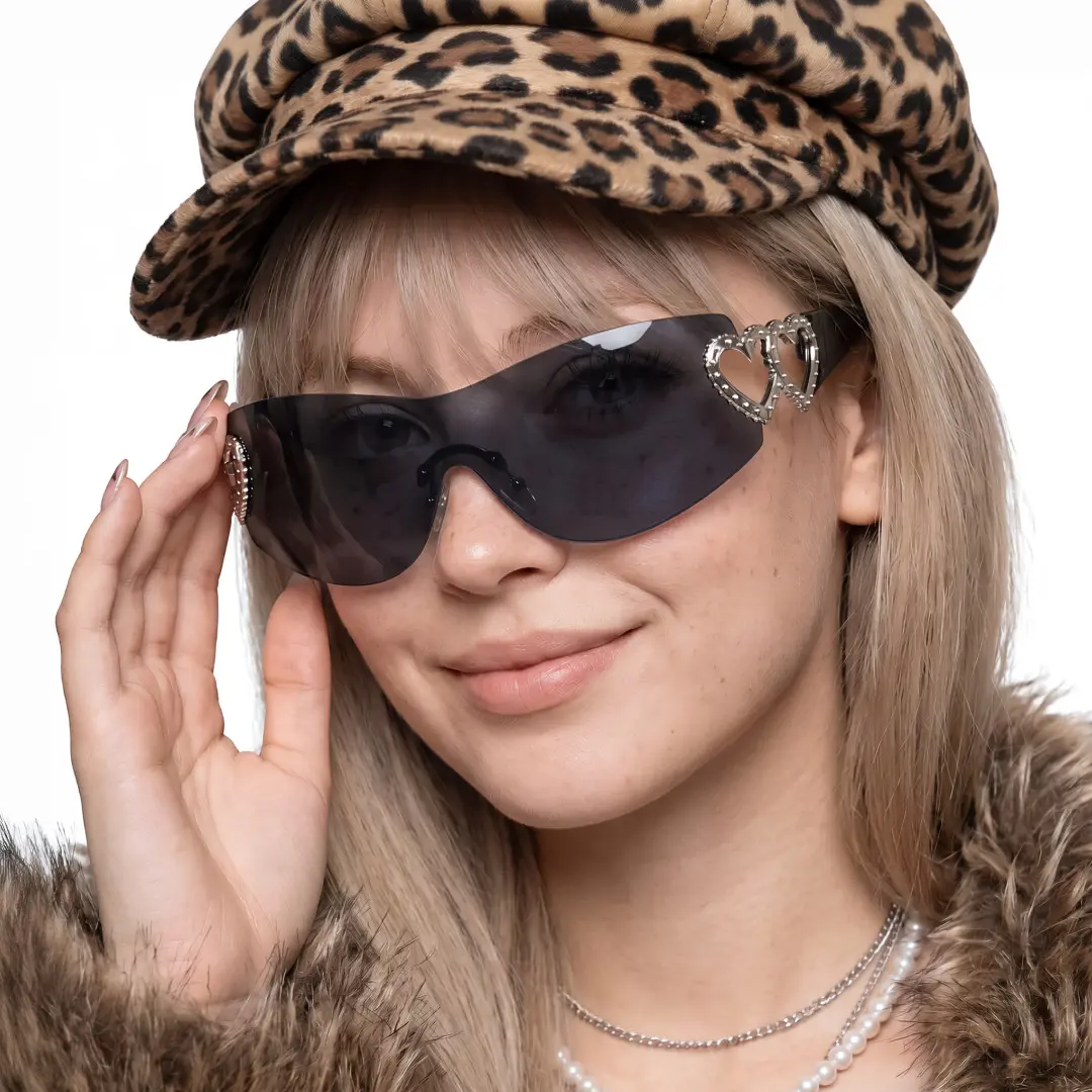 Female wearing y2k black rectangle pc sunglasses, natural smile while touching frame. SPU: EP0022604
