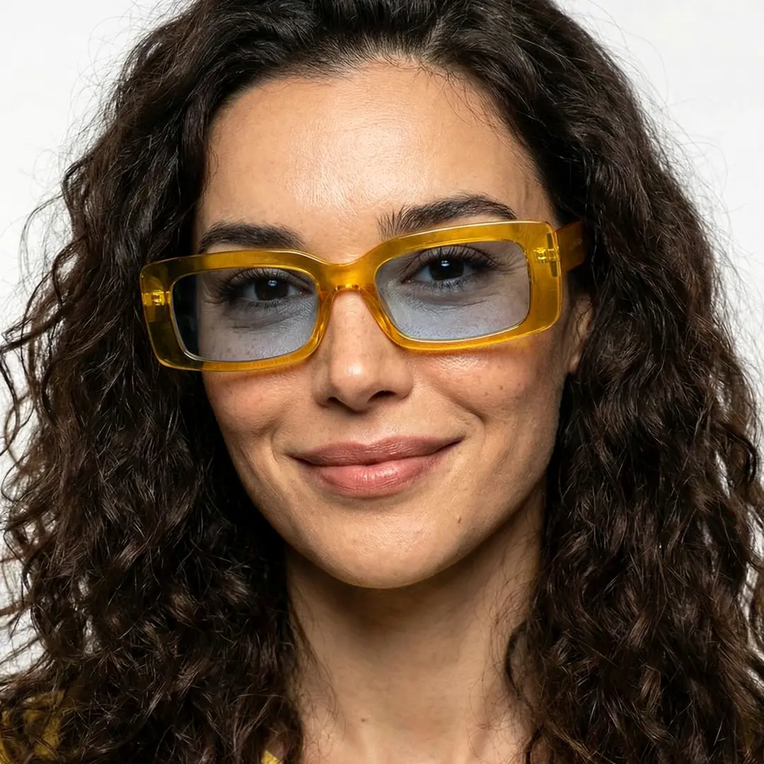 Front view of female wearing fashion yellow rectangle sunglasses, soft smile, EP0042212