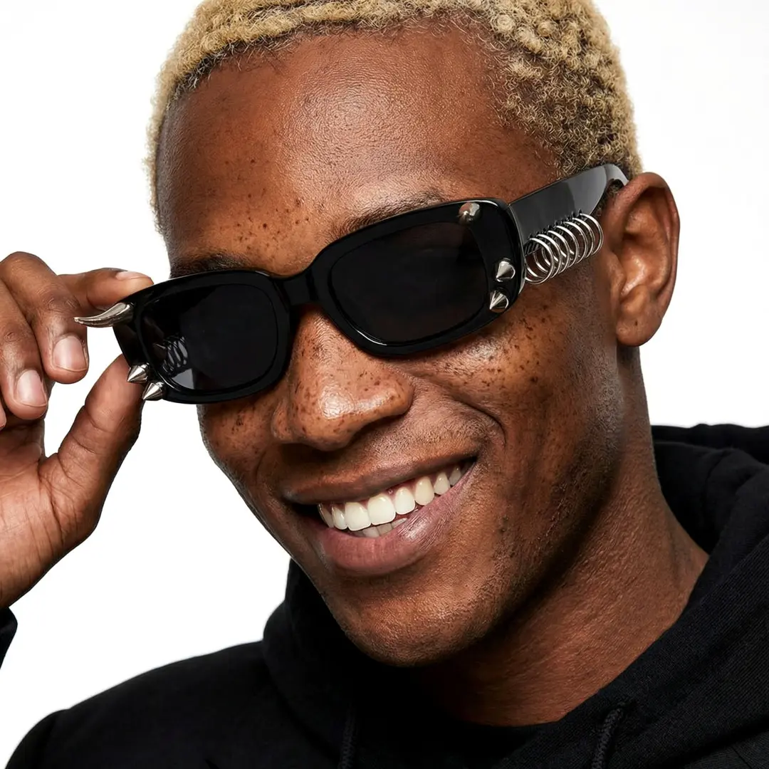 Male wearing black rectangle handcrafted polarized sunglasses, touching frame, smiling, EP0082601