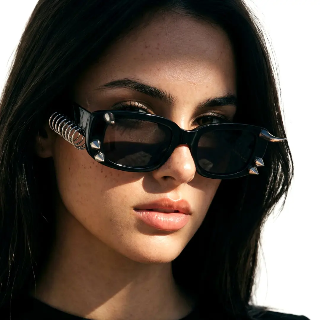 Front view of female wearing black rectangle handcrafted polarized sunglasses, natural expression, EP0082601