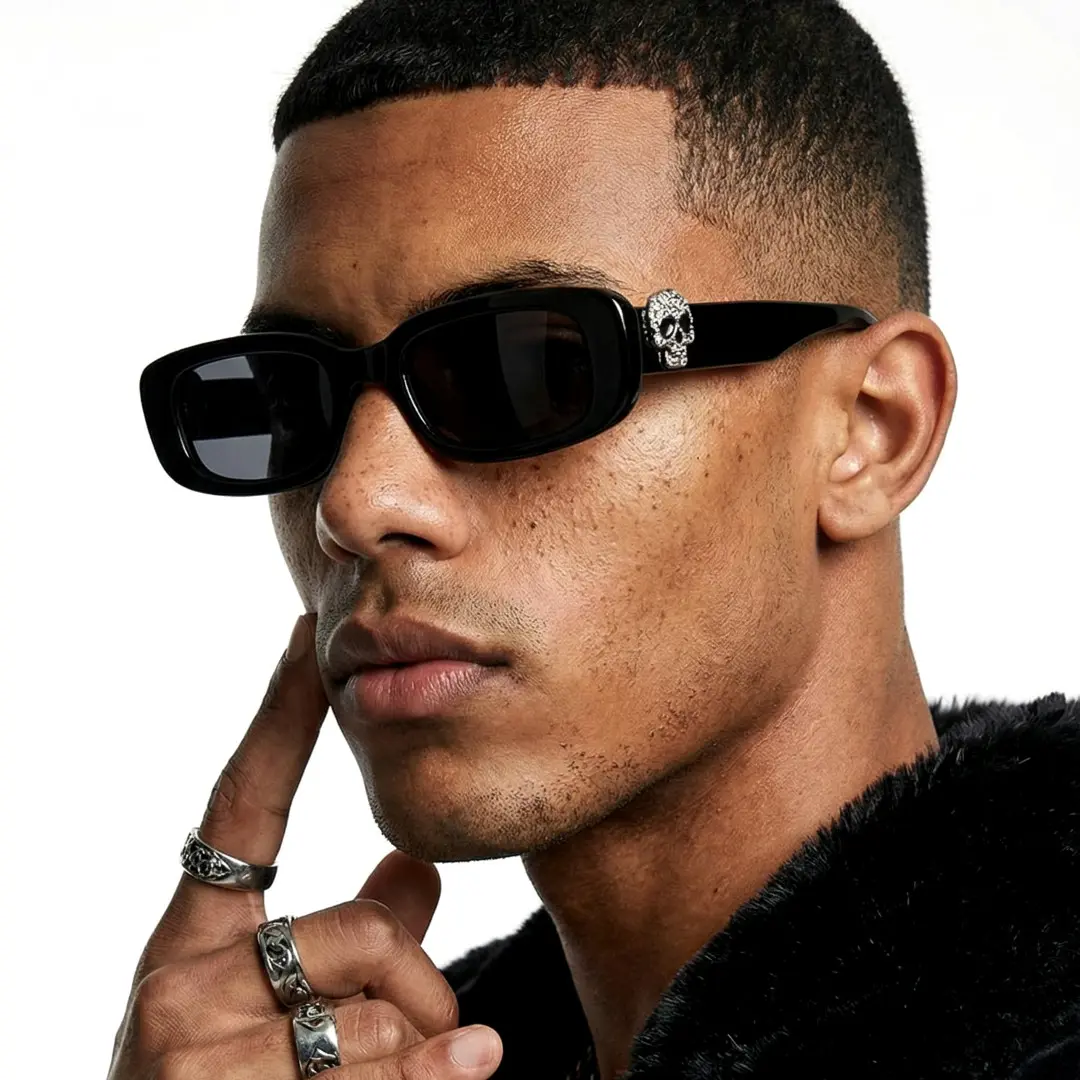 Over-the-shoulder view of male wearing black rectangle sunglasses, hand near face, neutral expression, EP0092511