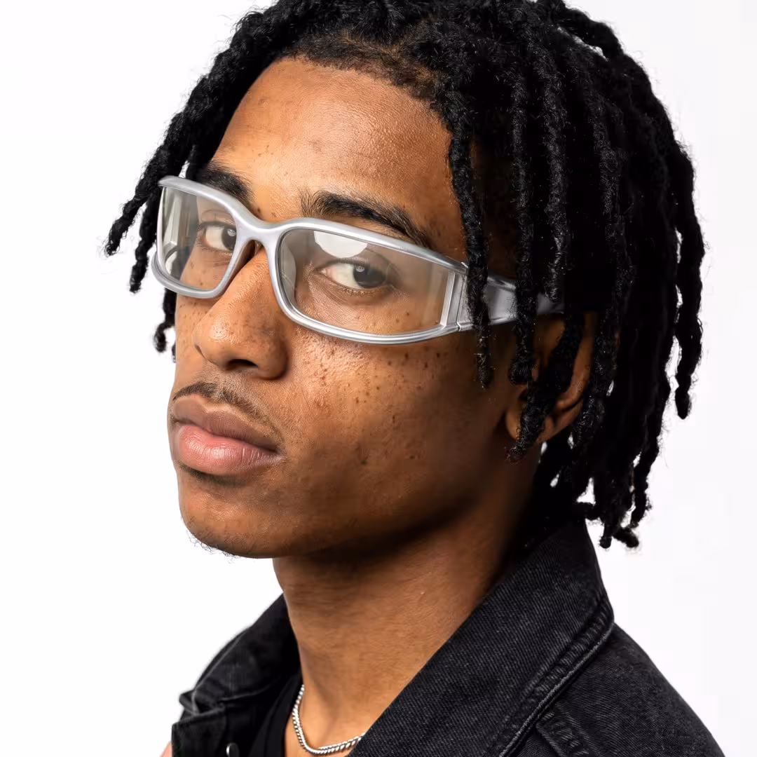 Male wearing y2k silver rectangle pc sunglasses, neutral expression. SPU: EP0092605