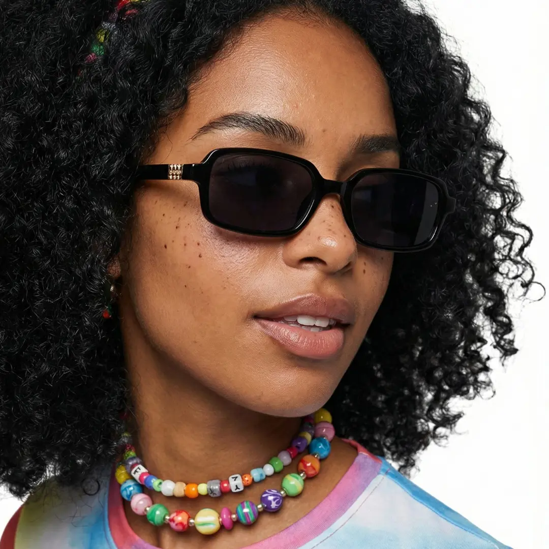 Looking away view of female wearing black rectangle sunglasses, natural expression, EP0172507