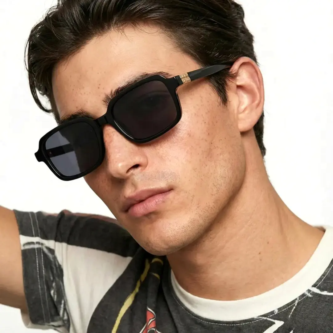 Male wearing vintage black rectangle pc sunglasses, calm expression while tilting head. SPU: EP0172507