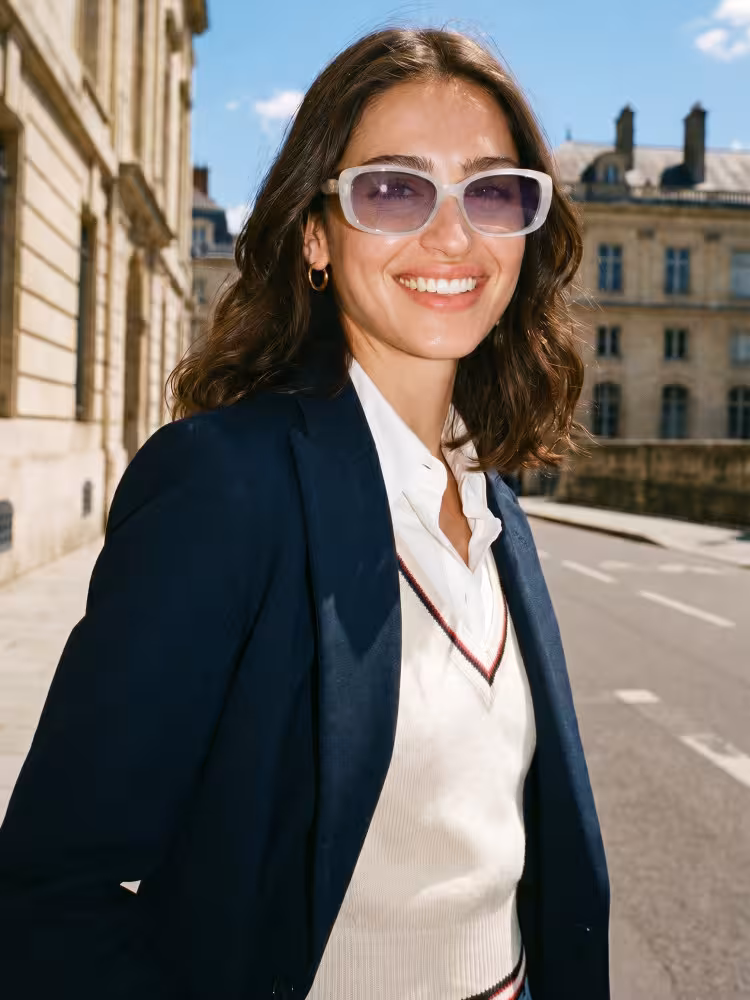 Female model wearing luxury white rectangle pc sunglasses on a sunny European city street. SPU: AA0222603