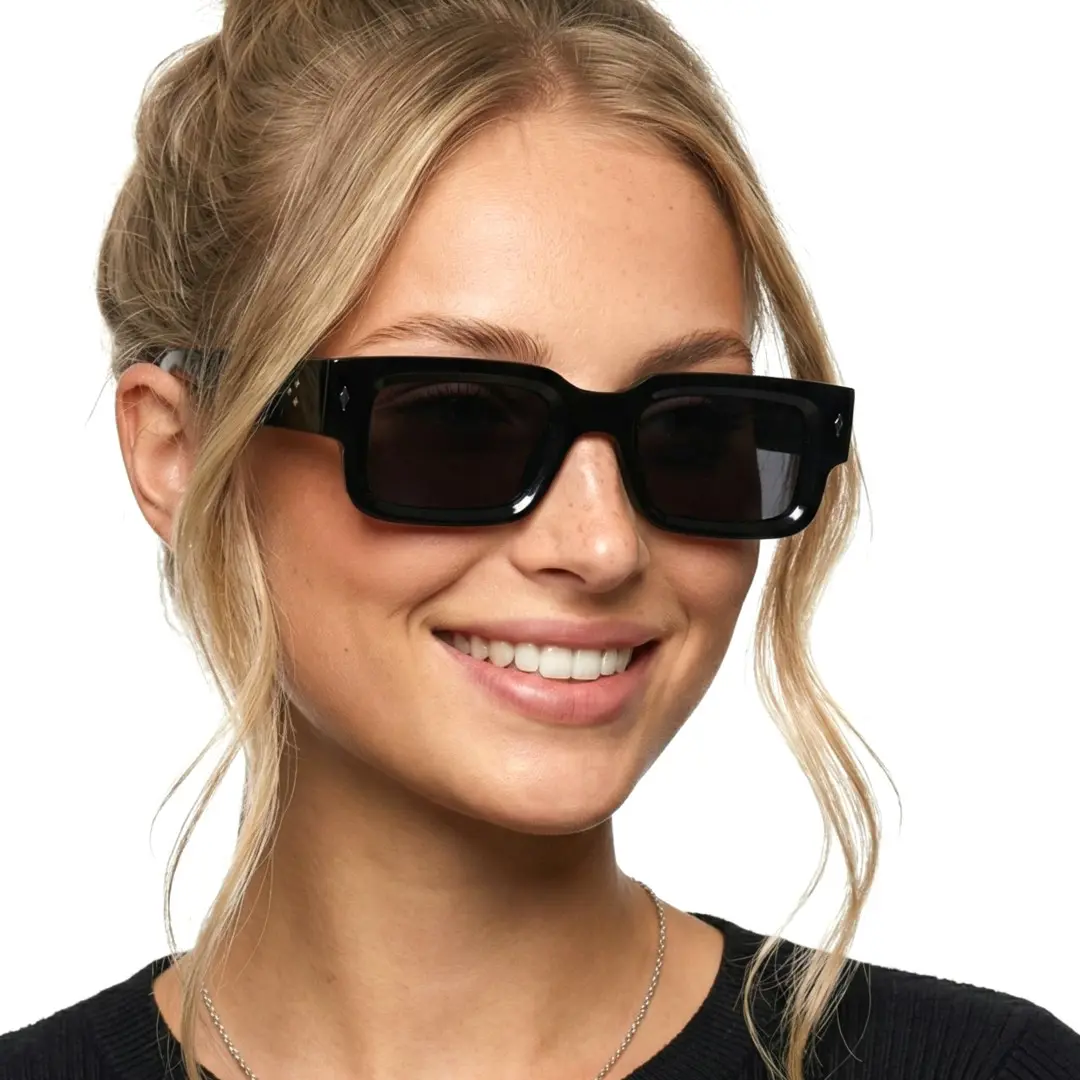 Three-quarter view of female wearing black rectangle sunglasses, natural smile, EP0542509S