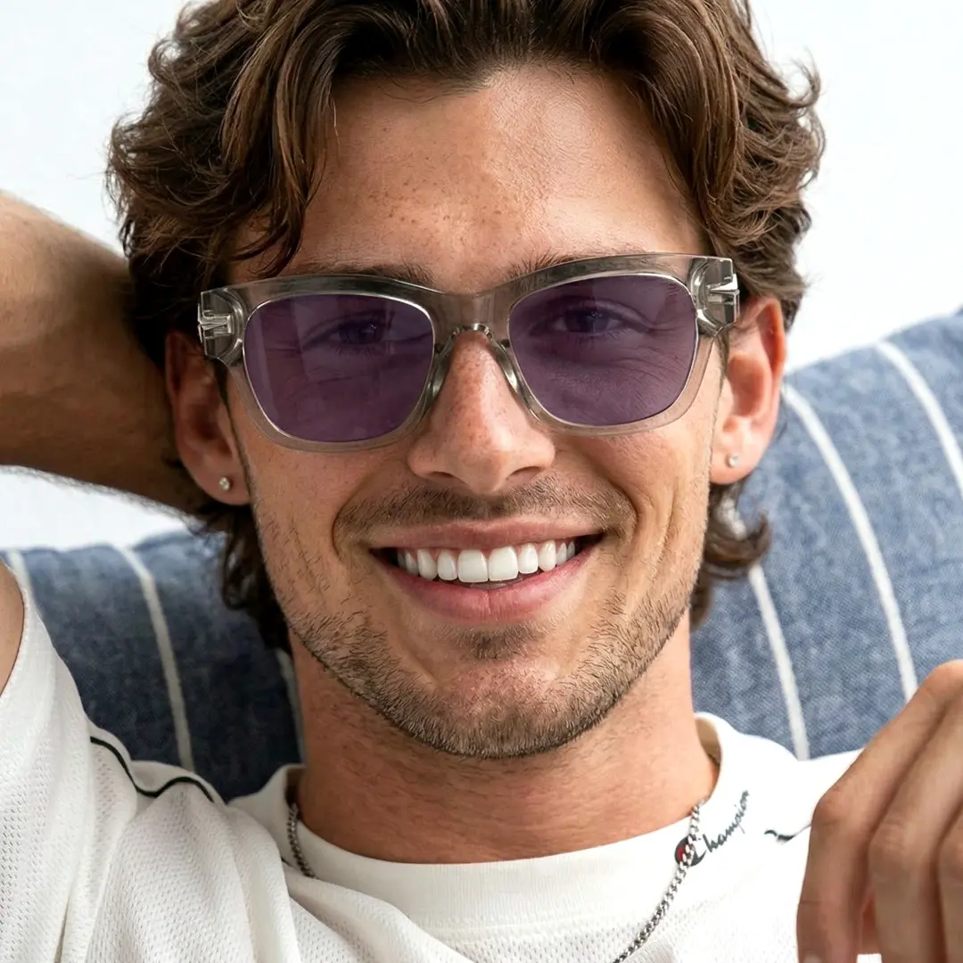 Front view of male wearing brown rectangle sunglasses, natural smile, ER0022604