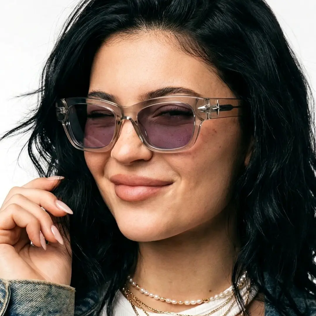 Three-quarter view of female wearing brown rectangle sunglasses, hand near face, wink, ER0022604