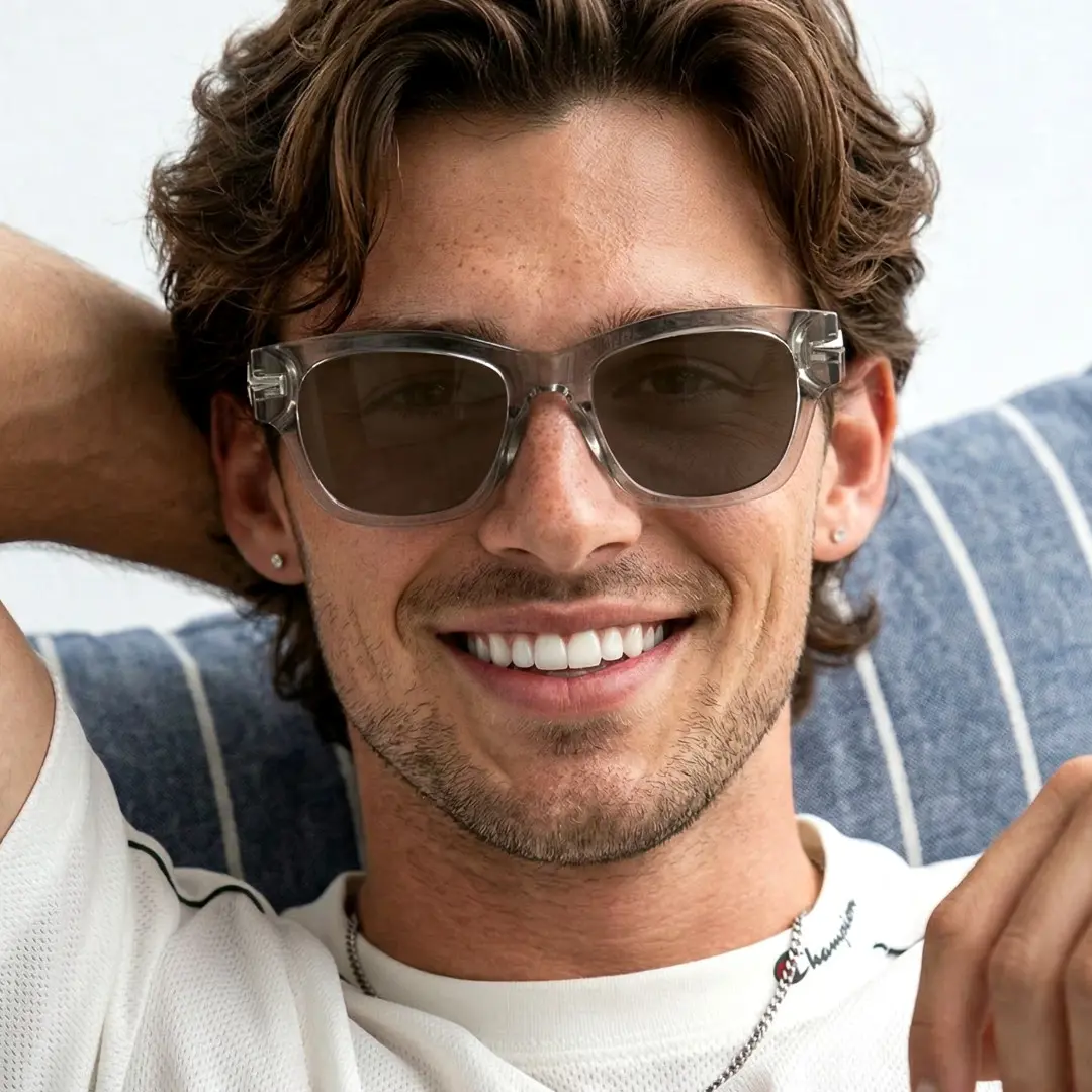 Front view of male wearing fashion brown rectangle sunglasses, natural smile, ER0022604