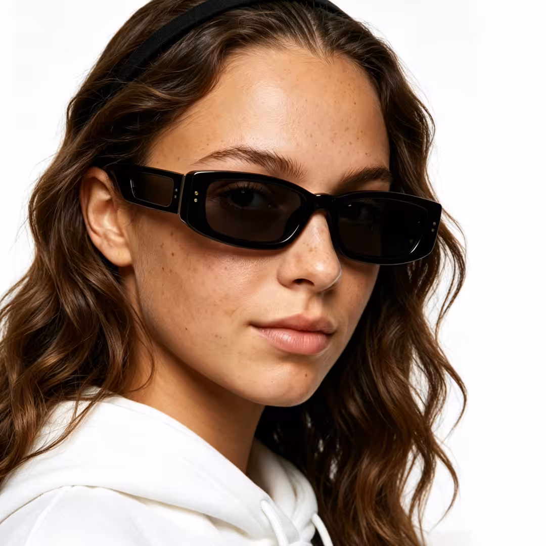 Close-up view of female wearing fashion black rectangle sunglasses, neutral expression, ER0132604