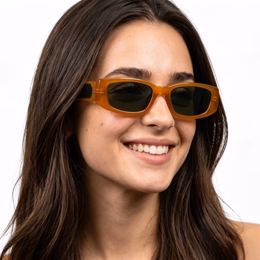 Three-quarter view of female wearing fashion yellow rectangle sunglasses, smiling, ER0132604