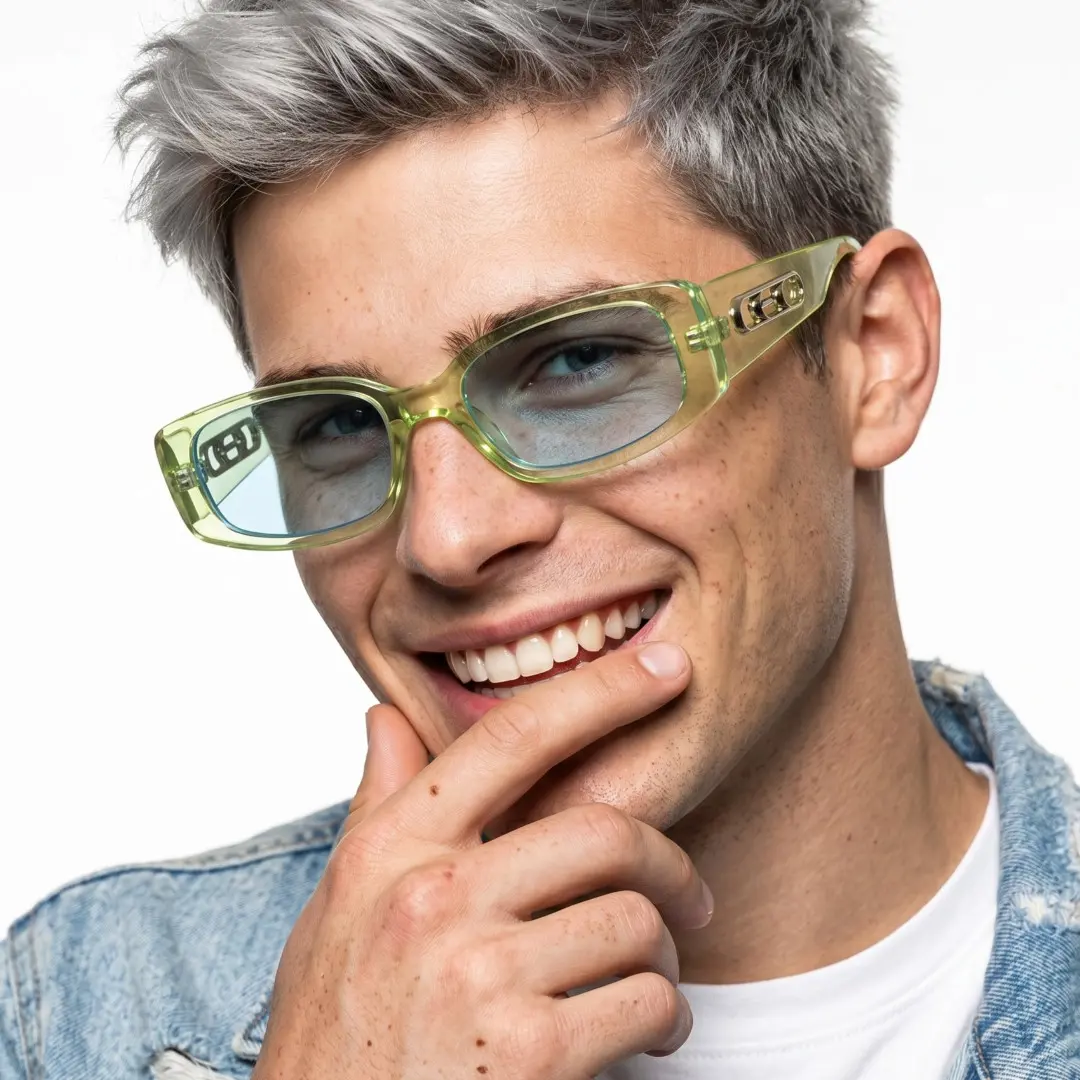 Three-quarter view of male wearing fashion green rectangle sunglasses, hand resting on chin, smiling, ER0142604