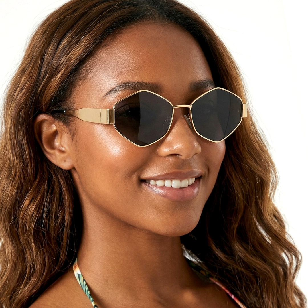 Slightly angled view of female wearing gold geometric sunglasses, smiling, GM0132506