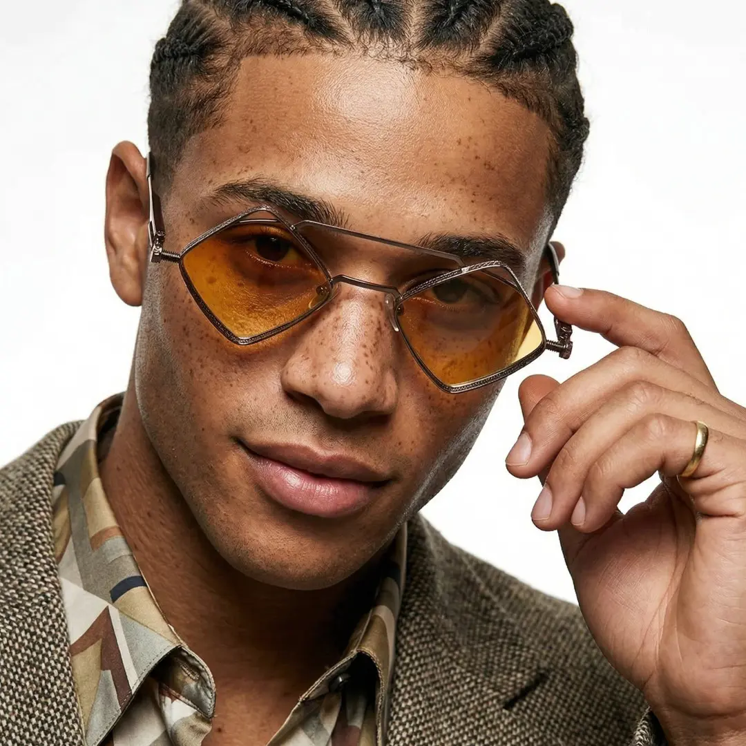 Front view of male wearing steampunk brown geometric sunglasses, touching frame, natural smile, GM0152604