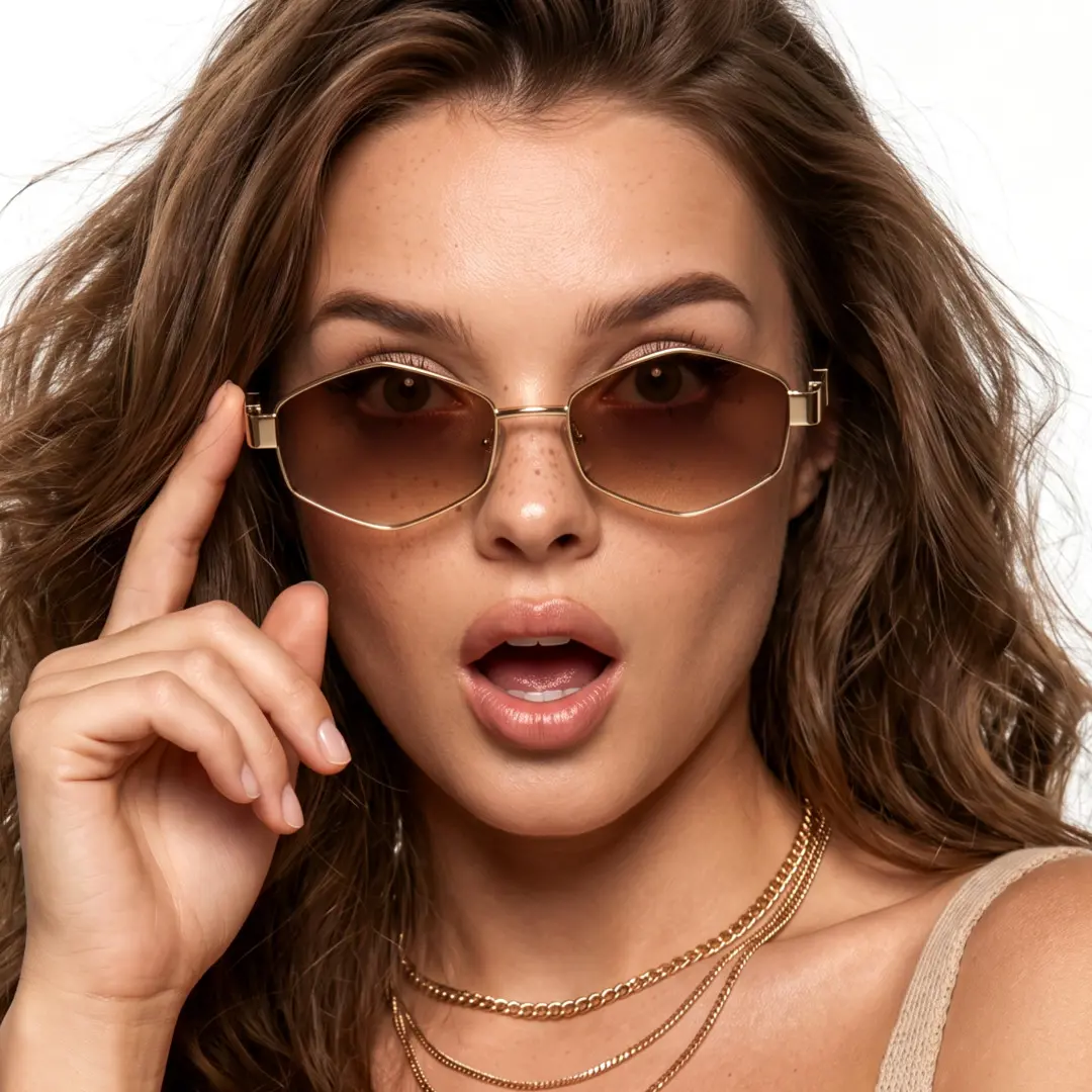 Front view of female wearing gold geometric sunglasses, touching frame, surprised expression, GM0282603