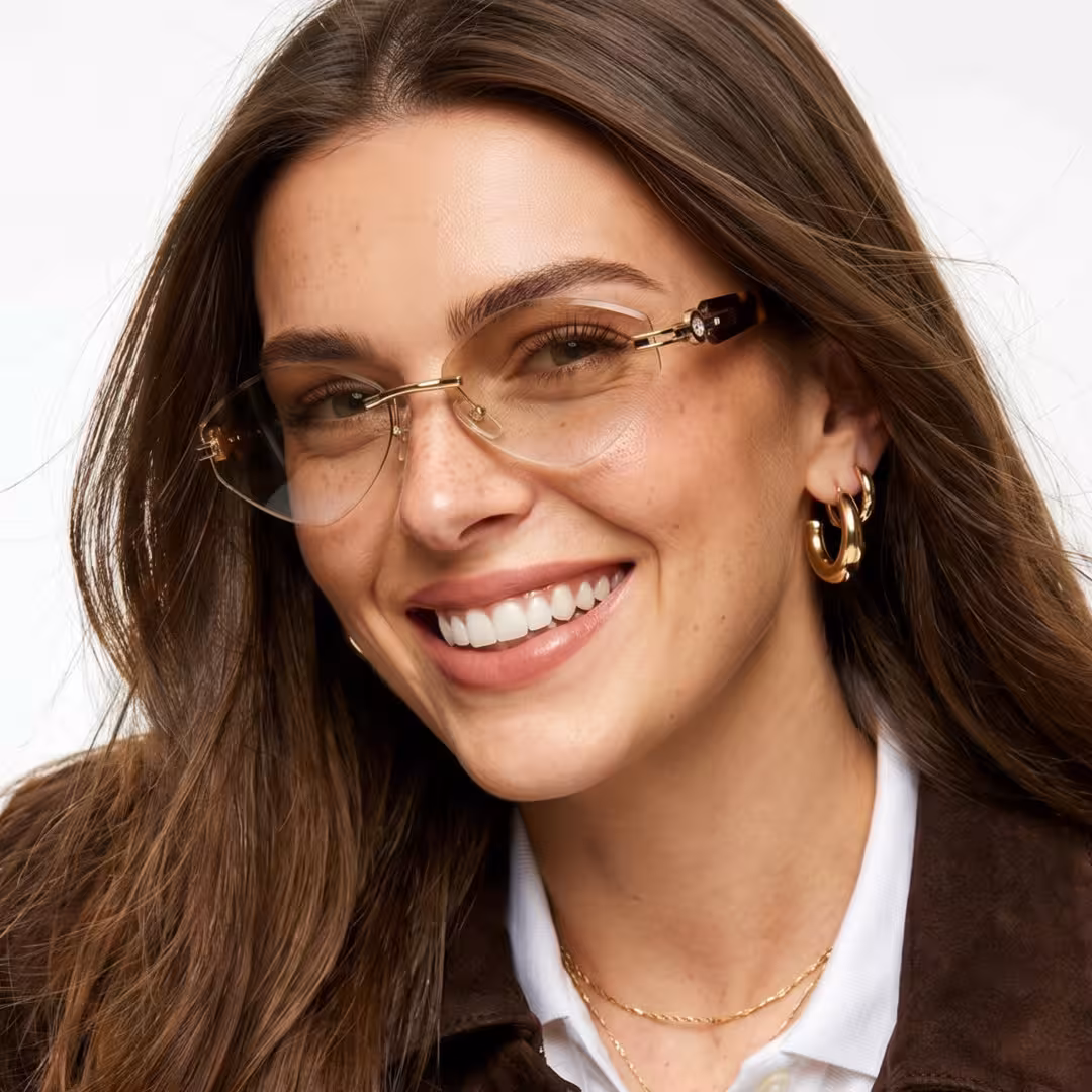 Front view of female wearing fashion tortoise geometric sunglasses, smiling, GP0102604