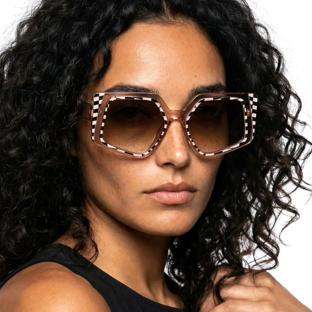 Three-quarter view of female wearing fashion brown geometric sunglasses, neutral expression, GP0222507