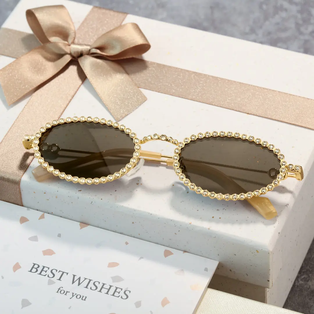 Scene view of Earlene oval metal sunglasses OM0132409 in gold