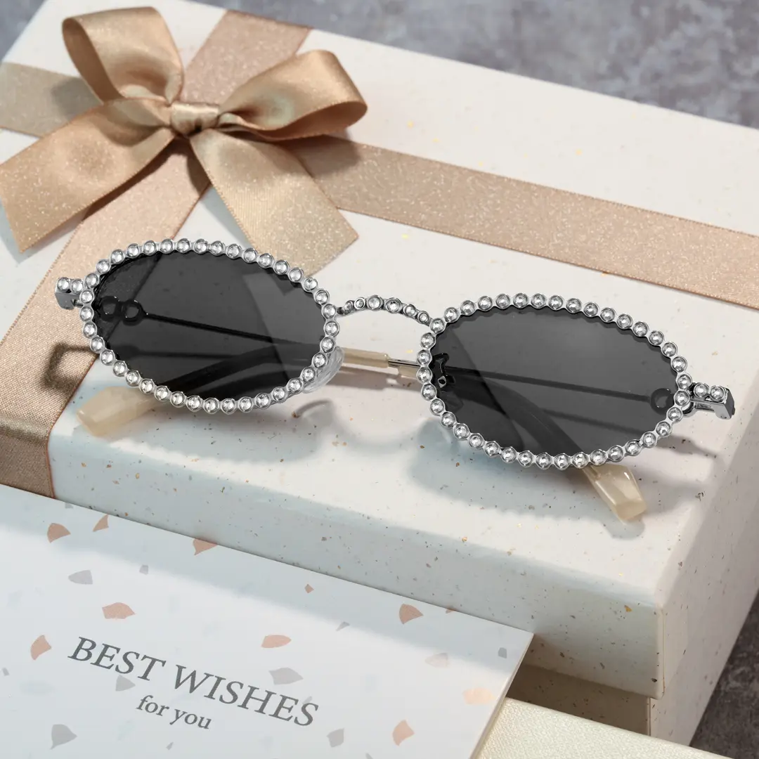 Scene close-up view of Earlene oval metal sunglasses OM0132409 in grey