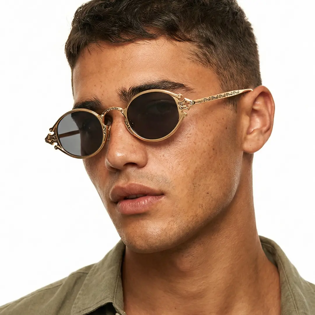 Three-quarter view of male wearing fashion gold oval sunglasses, tilting head, relaxed expression, OM0352601