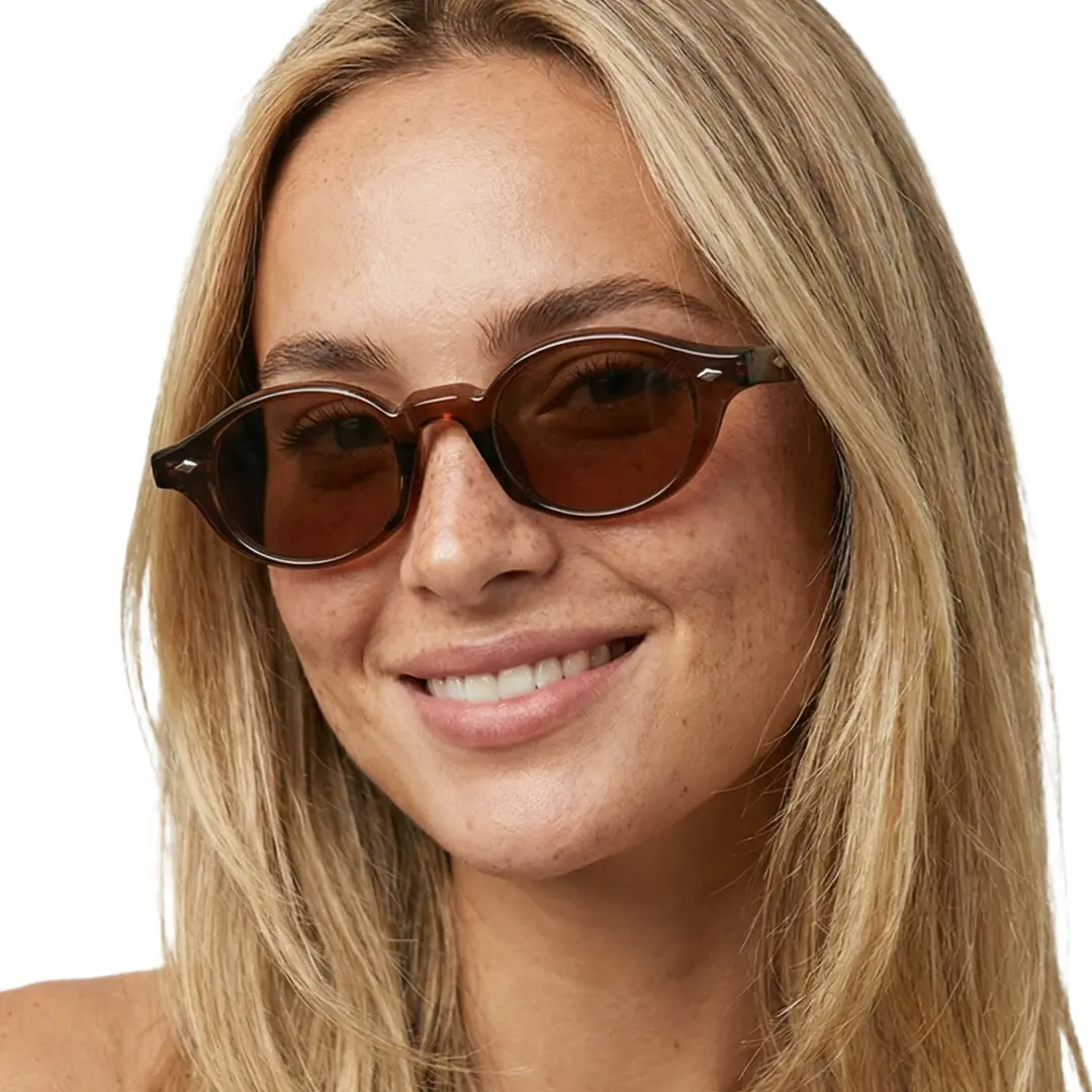 Three-quarter view of female wearing beige oval sunglasses, friendly smile, OP0062505
