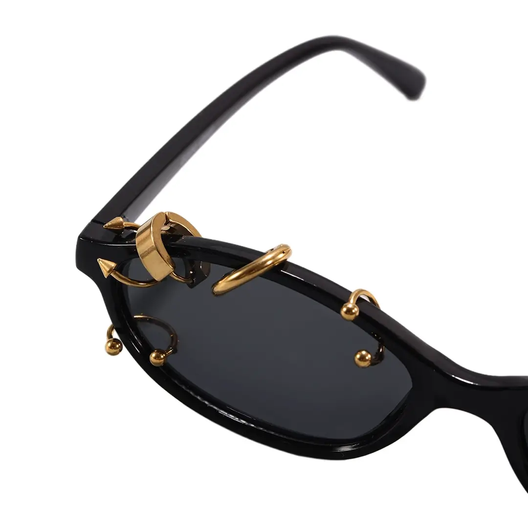 Frame rivet detail view of Epoch oval pc handcrafted polarized sunglasses OP0092604 in gold