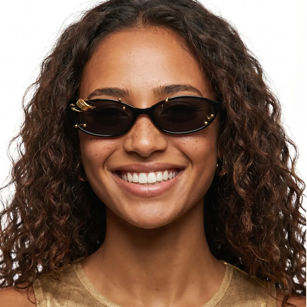 Close-up view of female wearing gold oval handcrafted polarized sunglasses, smiling, OP0092604