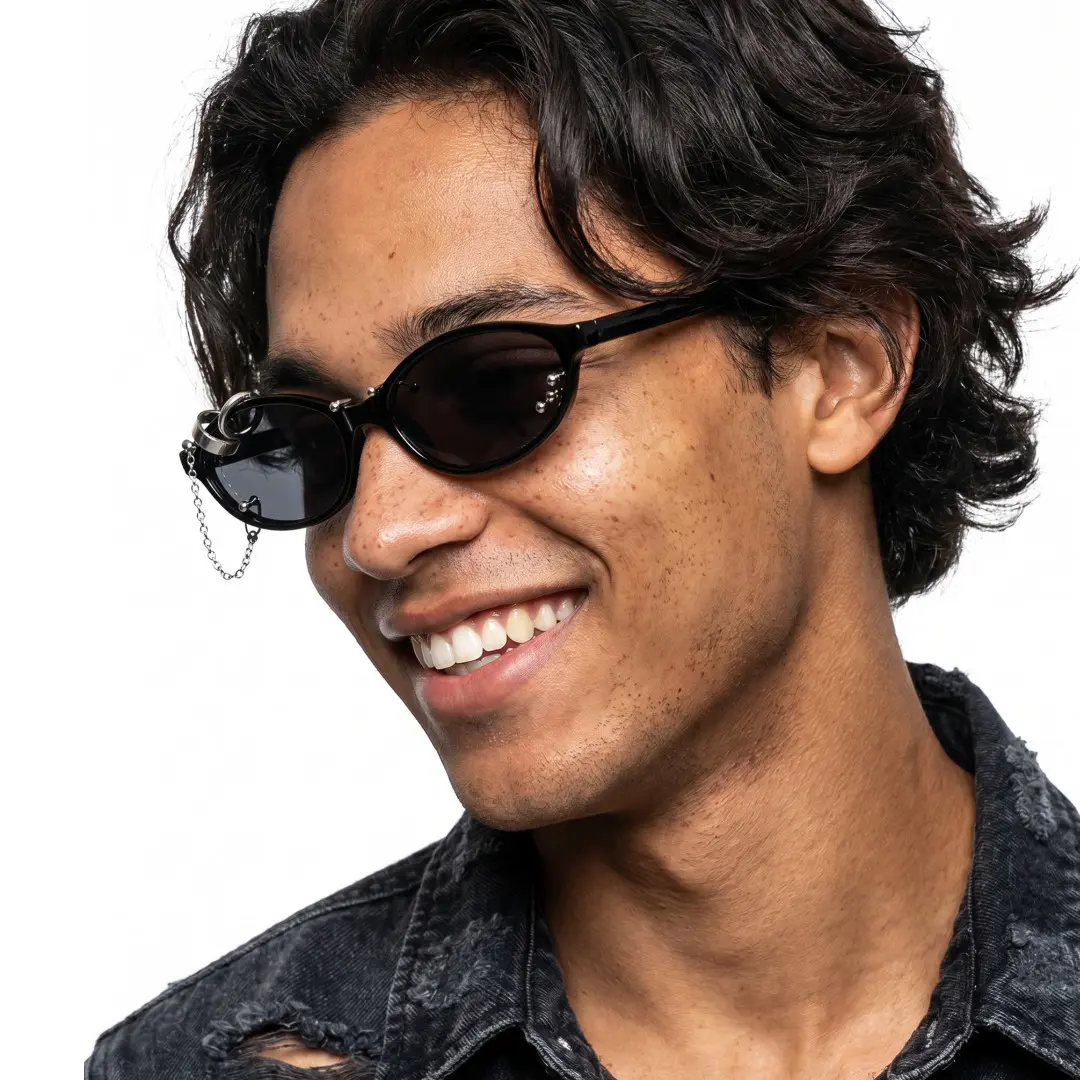 Profile view of male wearing silver oval handcrafted polarized sunglasses, smiling, OP0092604