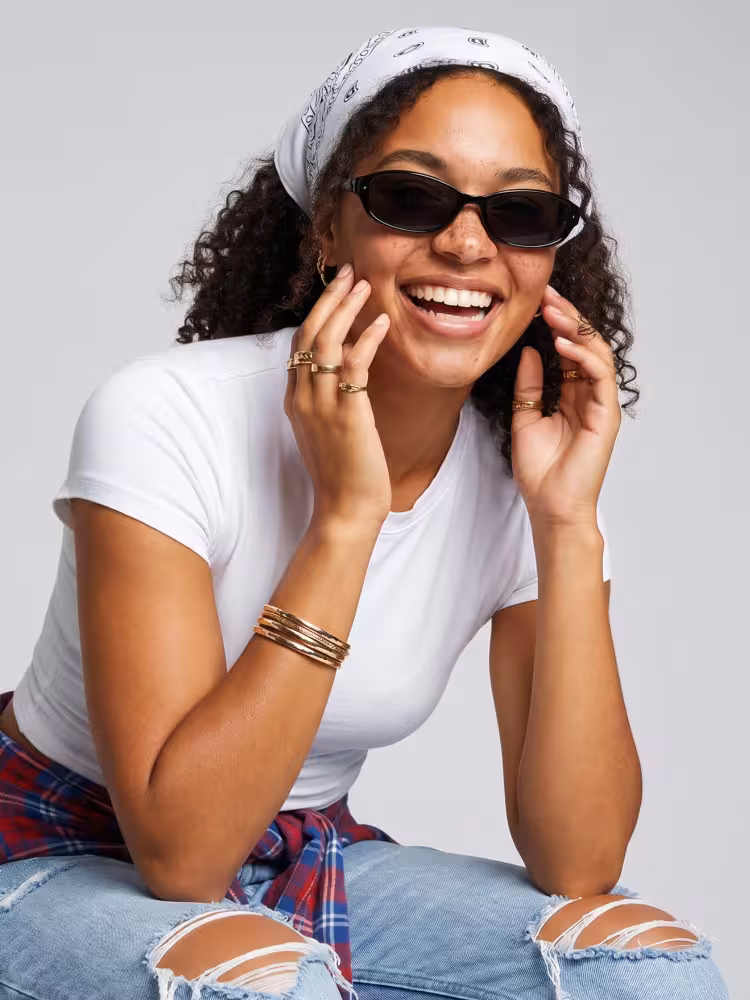 Female model wearing y2k black oval pc sunglasses in a clean studio setting. SPU: OP0332604