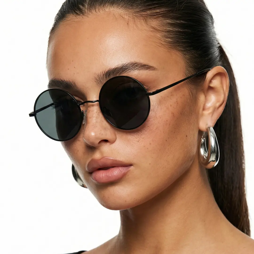 Profile view of female wearing black round sunglasses, neutral expression, RM0012207