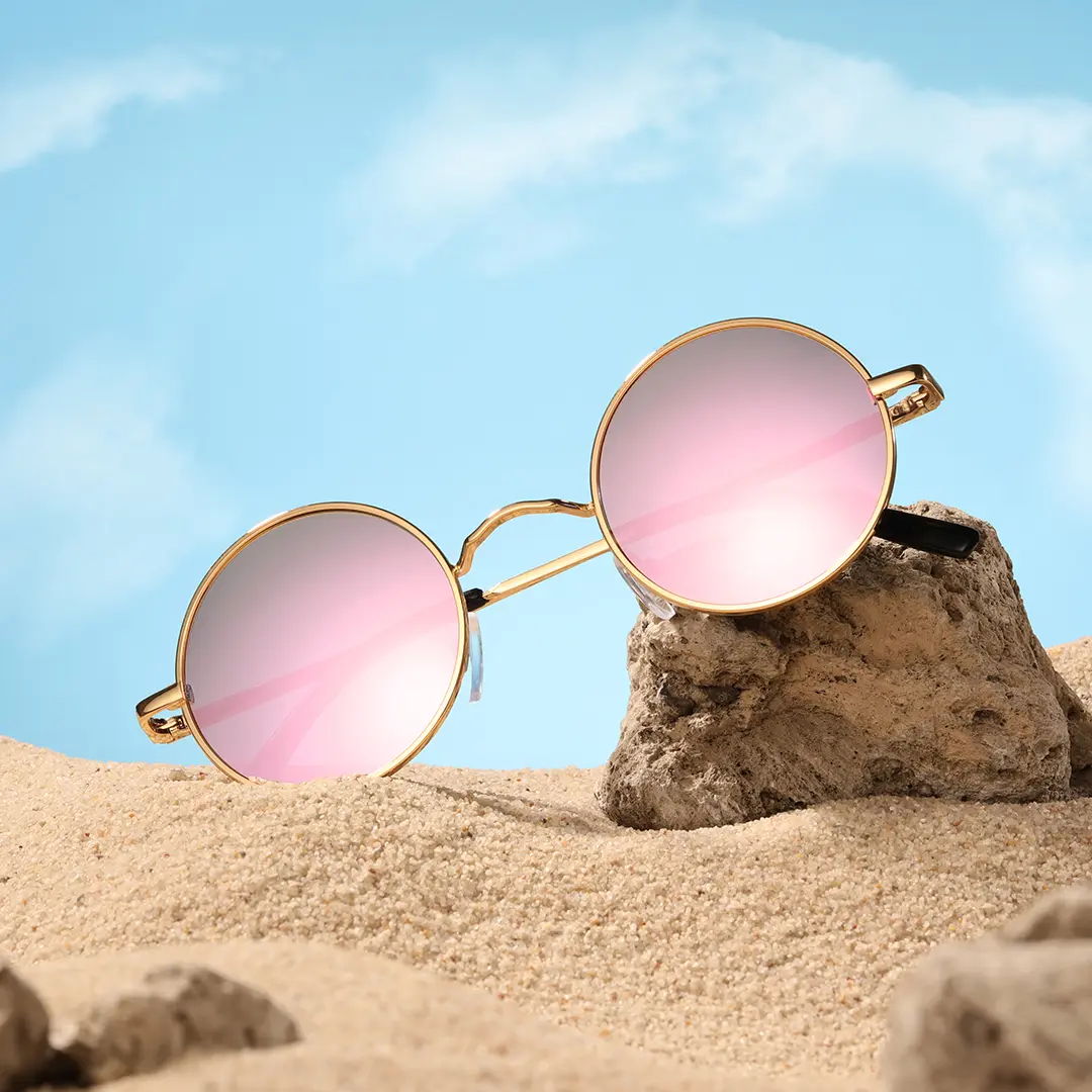 Scene close-up view of Kaleb round metal sunglasses RM0012207 in pink