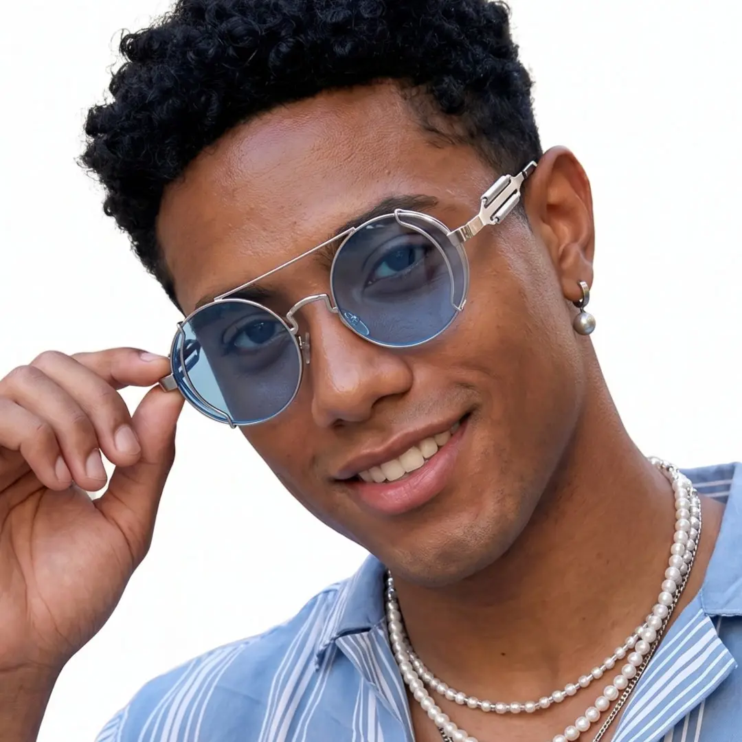 Front view of male wearing steampunk blue round sunglasses, touching frame, smiling, RM0102303