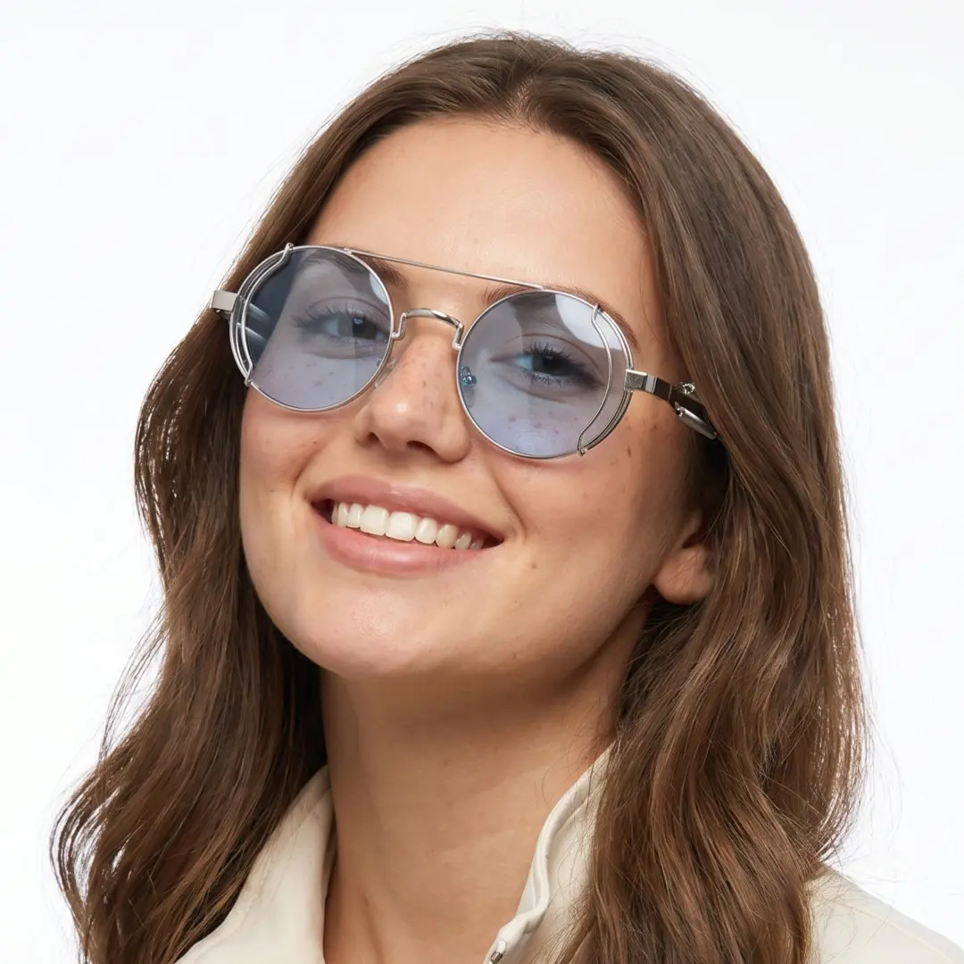 Three-quarter view of female wearing steampunk silver blue round sunglasses, big smile, RM0102303