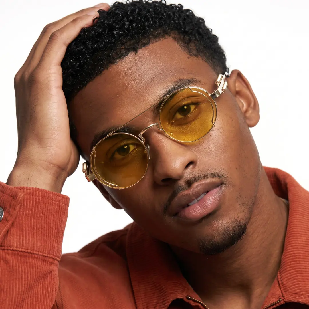 Three-quarter view of male wearing steampunk yellow round sunglasses, neutral expression, RM0102303